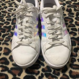 White metallic adidas shoes.